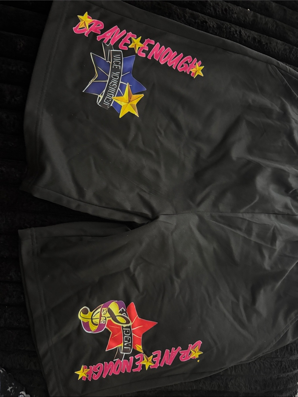 Fashion Nova Black Shorts with Pink, Yellow and Blue Star Graphics